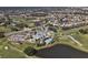 Aerial view of community clubhouse, pool, and golf course at 1207 Highland Greens Dr, Venice, FL 34285