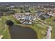 Aerial view of community clubhouse, pool, and golf course at 1207 Highland Greens Dr, Venice, FL 34285