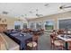 Casual dining area with large windows and golf course views at 1207 Highland Greens Dr, Venice, FL 34285