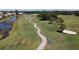 Golf course path along a waterway at 1207 Highland Greens Dr, Venice, FL 34285