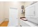 Convenient laundry room with washer, dryer, and storage at 1207 Highland Greens Dr, Venice, FL 34285