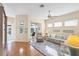 Bright living room with hardwood floors, comfy furniture, and access to a patio at 1207 Highland Greens Dr, Venice, FL 34285