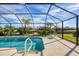 Inviting screened pool with lake view at 1207 Highland Greens Dr, Venice, FL 34285