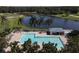 Community pool with lounge chairs at 1207 Highland Greens Dr, Venice, FL 34285