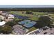 Two tennis courts near homes and parking at 1207 Highland Greens Dr, Venice, FL 34285