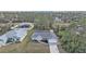 Aerial view of a home with a well maintained lawn and beautiful trees at 1230 Gantry Rd, North Port, FL 34288