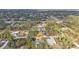 Aerial view of the property showcasing its location amidst lush greenery and a residential neighborhood at 1230 Gantry Rd, North Port, FL 34288