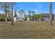 Spacious backyard features a shed and screened lanai, offering ample room to enjoy at 1230 Gantry Rd, North Port, FL 34288