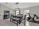 Dining room with breakfast bar, modern light fixture and furniture, and tile floor at 1230 Gantry Rd, North Port, FL 34288