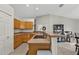 Spacious kitchen area with wooden cabinetry, ample counter space, and stylish fixtures at 1230 Gantry Rd, North Port, FL 34288