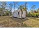 Backyard shed offers additional space for storage and lawn equipment at 1230 Gantry Rd, North Port, FL 34288