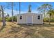 Outdoor shed provides extra storage with convenient access at 1230 Gantry Rd, North Port, FL 34288