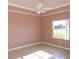 Bedroom with a ceiling fan and a window at 1235 Saxony Cir # 5105, Punta Gorda, FL 33983