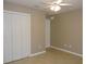 Bedroom with a ceiling fan and a closet at 1235 Saxony Cir # 5105, Punta Gorda, FL 33983