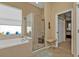 Bathroom features a walk-in shower and garden tub at 13298 Scrub Jay Ct, Port Charlotte, FL 33953