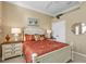 Bright bedroom with a queen-size bed and ensuite access at 13298 Scrub Jay Ct, Port Charlotte, FL 33953