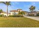 Beautiful house exterior with lush landscaping and tile roof at 13298 Scrub Jay Ct, Port Charlotte, FL 33953