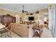 Living room with L-shaped sectional sofa and built-in shelving at 13298 Scrub Jay Ct, Port Charlotte, FL 33953