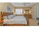 Main bedroom with king-size bed and ensuite bathroom at 13298 Scrub Jay Ct, Port Charlotte, FL 33953