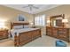 Main bedroom with king-size bed and ensuite bathroom at 13298 Scrub Jay Ct, Port Charlotte, FL 33953