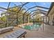 Enjoy this beautiful pool and spa with screened enclosure at 13298 Scrub Jay Ct, Port Charlotte, FL 33953