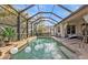 Escape to this refreshing pool with screened enclosure at 13298 Scrub Jay Ct, Port Charlotte, FL 33953