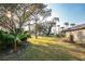 Landscaped backyard with basketball court at 157 Angol St, Punta Gorda, FL 33983