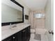 Bathroom with dark vanity and shower/tub combo at 157 Angol St, Punta Gorda, FL 33983