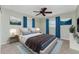 Main bedroom with ceiling fan and blue accents at 157 Angol St, Punta Gorda, FL 33983