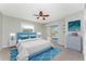 Main bedroom with blue bedding and pool view at 157 Angol St, Punta Gorda, FL 33983