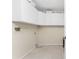 Laundry room with upper cabinets and tile floor at 157 Angol St, Punta Gorda, FL 33983