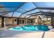 Inviting screened pool and spa with covered lanai at 157 Angol St, Punta Gorda, FL 33983