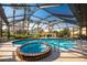 Relaxing pool and spa area with screened enclosure at 157 Angol St, Punta Gorda, FL 33983