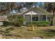 House exterior with a covered porch, landscaping, and fire hydrant at 1577 Red Oak Ln, Port Charlotte, FL 33948