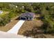 Single-story house with a garage and driveway, seen from above at 158 Chickering St, Port Charlotte, FL 33954