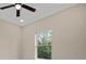 Bedroom with ceiling fan and window view at 158 Chickering St, Port Charlotte, FL 33954