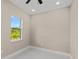 Bright bedroom with window and tile floors at 158 Chickering St, Port Charlotte, FL 33954