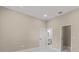 Bedroom with access to bathroom and neutral walls at 158 Chickering St, Port Charlotte, FL 33954