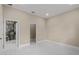 Bedroom with access to bathroom and tile flooring at 158 Chickering St, Port Charlotte, FL 33954