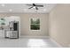 Bright dining area with tile flooring and ceiling fan at 158 Chickering St, Port Charlotte, FL 33954