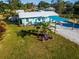 Cute beach cottage with palm tree and American flag at 159 Date St, Punta Gorda, FL 33980