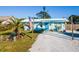 Charming beach cottage with a blue facade and gravel driveway at 159 Date St, Punta Gorda, FL 33980