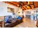 Relaxing living room with leather couch and wood accent walls at 159 Date St, Punta Gorda, FL 33980