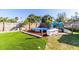 Inviting pool area with artificial turf and hammock at 159 Date St, Punta Gorda, FL 33980