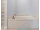 Bathroom with a corner soaking tub and glass block feature at 180 Hibiscus Dr # 112, Punta Gorda, FL 33950