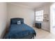 Small bedroom with blue bed frame and built-in dresser at 180 Hibiscus Dr # 112, Punta Gorda, FL 33950