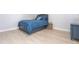 Cozy bedroom with blue bed frame and light wood floors at 180 Hibiscus Dr # 112, Punta Gorda, FL 33950