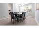 Elegant dining room featuring a wood table and gray chairs at 180 Hibiscus Dr # 112, Punta Gorda, FL 33950