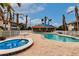 Relaxing community pool and spa area with lounge chairs at 180 Hibiscus Dr # 112, Punta Gorda, FL 33950