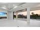 Elegant living room with tile floors, fireplace, and a water view at 183 Maria Ct, Punta Gorda, FL 33950